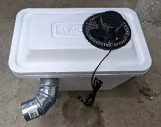 DIY no-grid air conditioning unit made from a cooler and a small fan, from No Grid Survival Projects